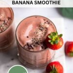 chocolate strawberry banana milkshake in a glass with a fresh strawberry on the rim.