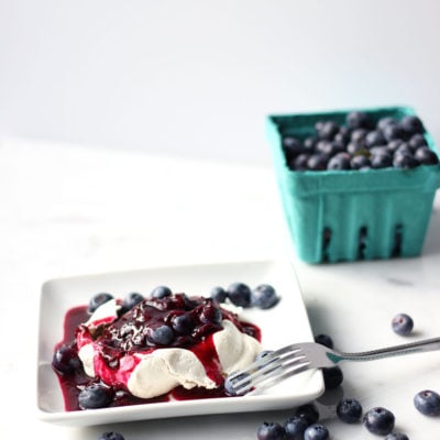 Pavlova with Boozy Blueberry Sauce