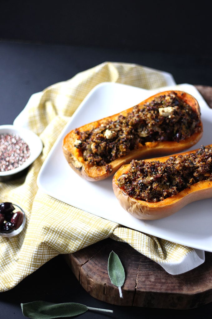 Stuffed Butternut Squash on a white plate with a yellow napkin. 