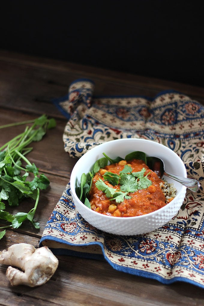 Vegan Chickpea Chana Masala topped with fresh cilantro in a white bowl. 