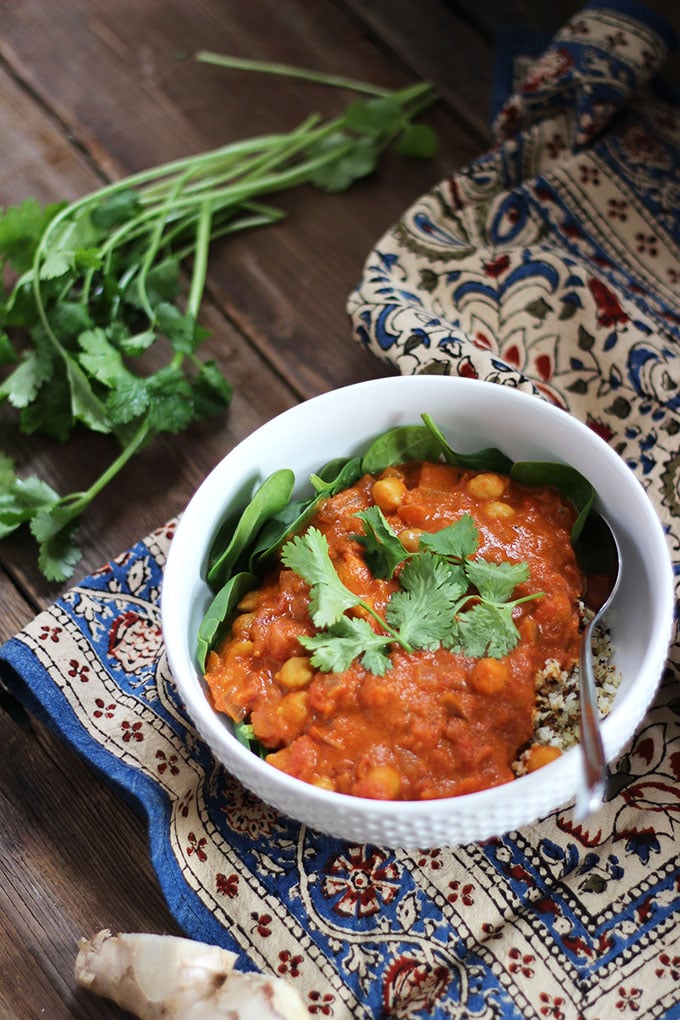 Vegan Chickpea Chana Masala topped with fresh cilantro in a white bowl. 