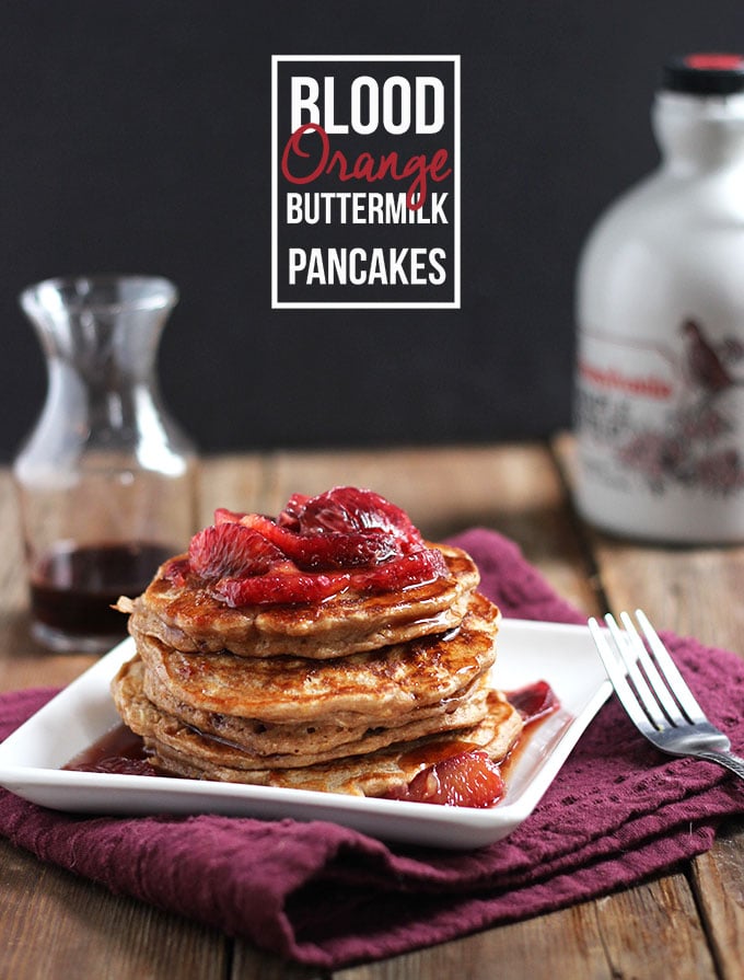 Blood Orange Buttermilk Pancakes stacked on a plate with a purple napkin.