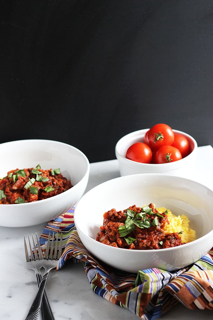 Vegetarian Bolognese garnished with basil in a white bowl.