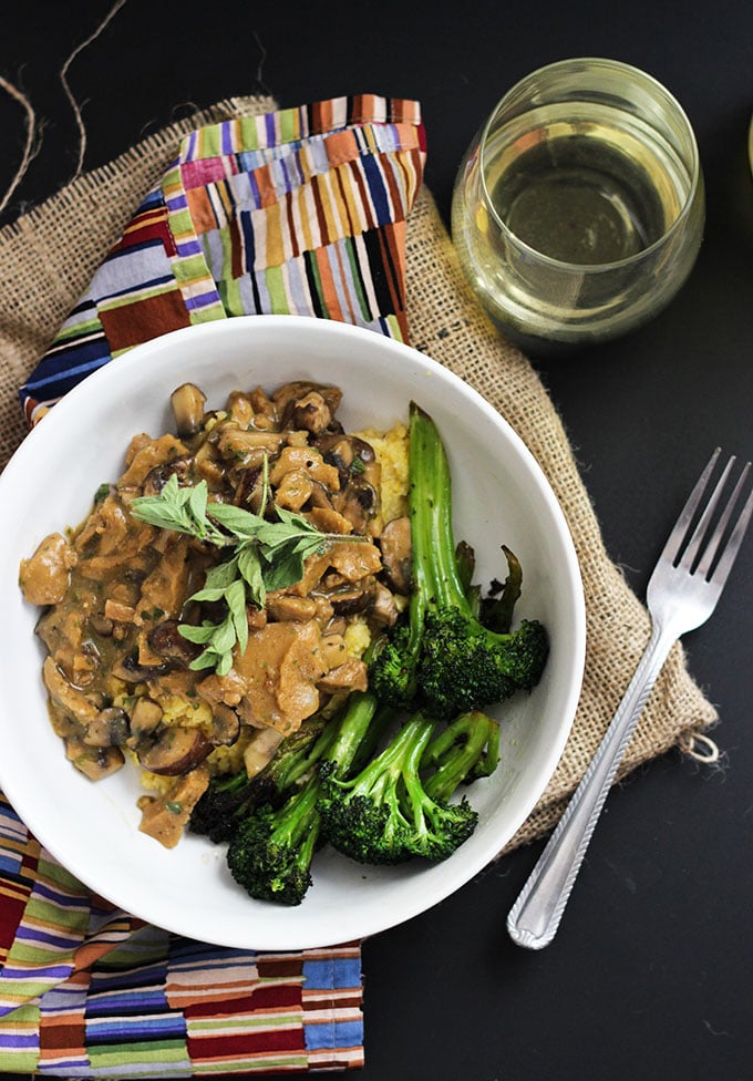 Vegan Seitan and Mushrooms with Polenta in a bowl with broccoli.