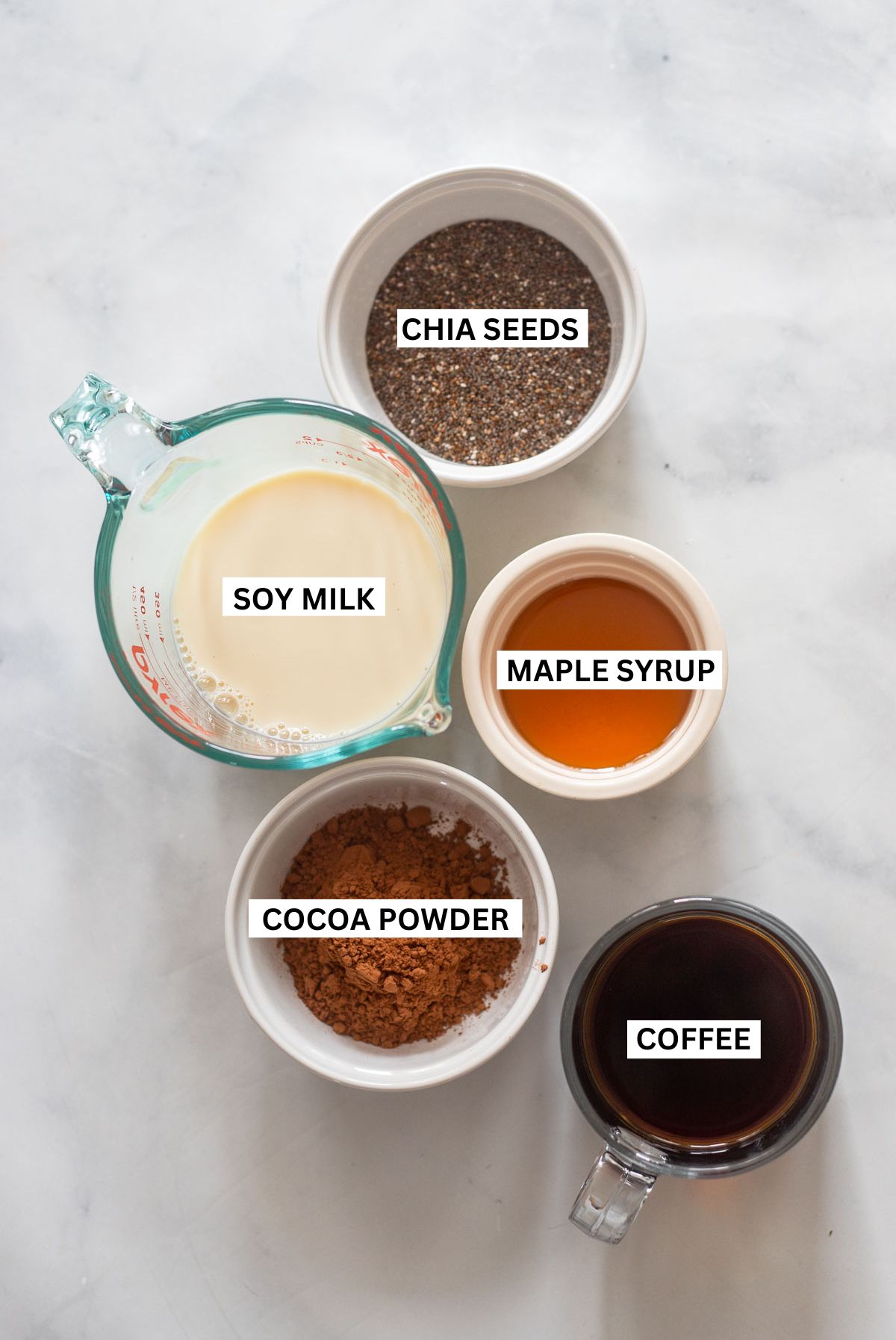 chocolate chia seed pudding ingredients in small bowls with text overlay for each ingredient.