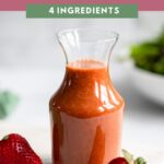 strawberry balsamic dressing in small glass carafe.