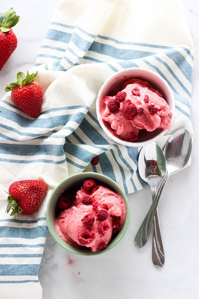 Strawberry Banana Frozen Yogurt in small dishes with spoons overhead shot