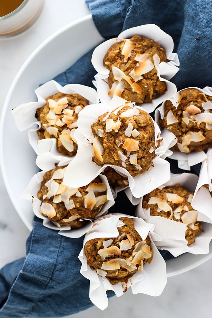 Morning Glory Bran Muffins in a white bowl with a blue napkin.