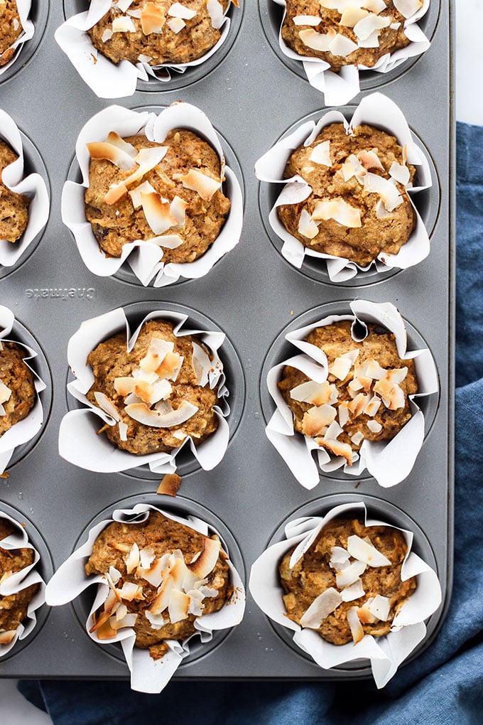 Morning Glory Bran Muffins in a muffin tin with a blue napkin.