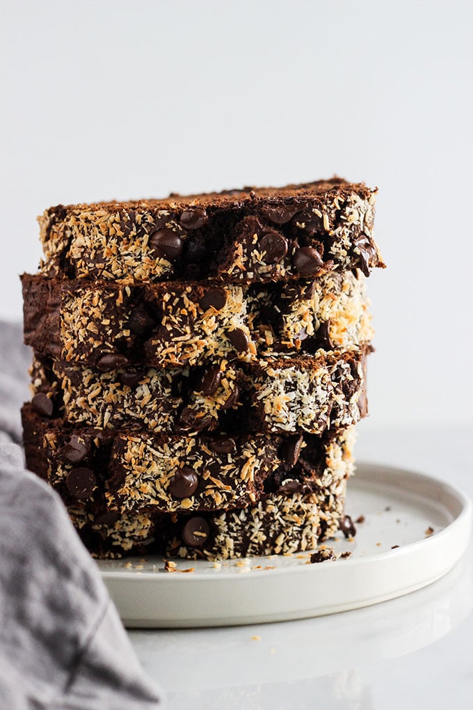 slices of Mocha Banana Bread stacked on a white plate. 