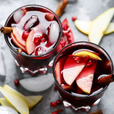 Pomegranate Ginger Sangria | The perfect simple cocktail for winter gatherings made with wine, ginger kombucha and fruit!