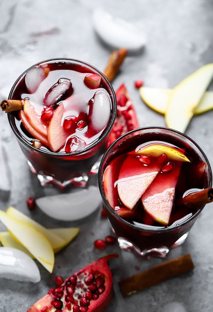 Pomegranate Ginger Sangria | The perfect simple cocktail for winter gatherings made with wine, ginger kombucha and fruit!