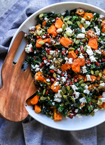 Winter Kale Salad | A healthy addition to your holiday gatherings! Made with roasted butternut squash, pomegranate, and goat cheese.