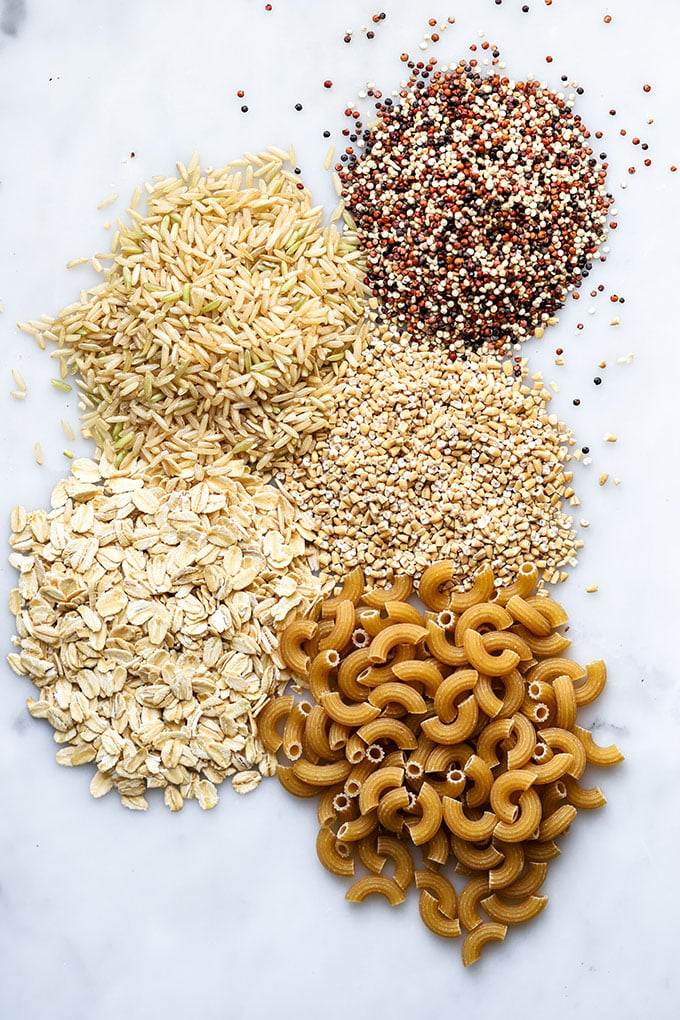 Small piles of grains on a white background.