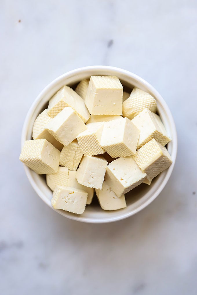 Cubed tofu in a white bowl.