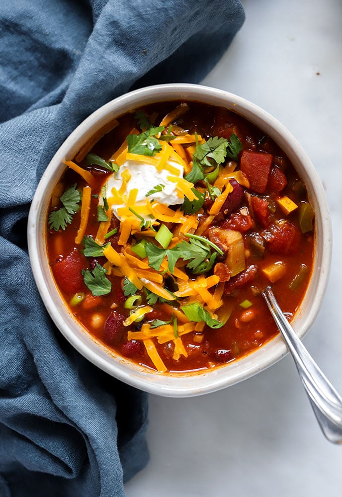 Four Bean Vegan slow cooker Chili in bowl with spoon.