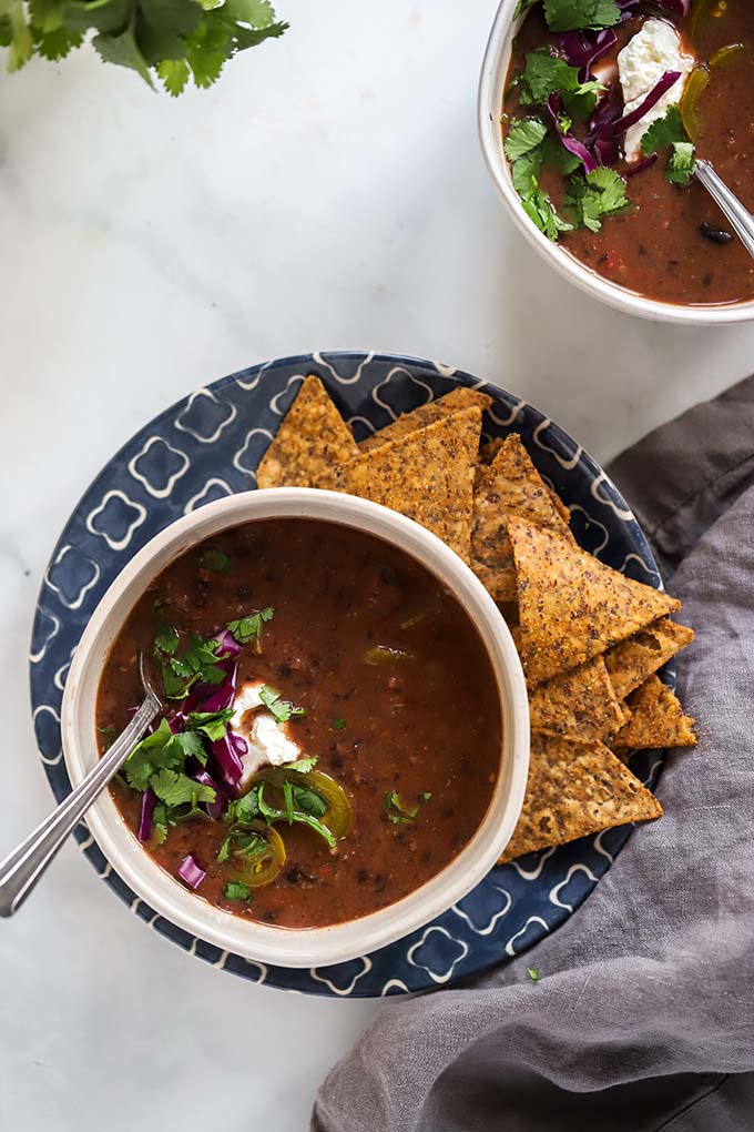 bowl of black bean soup with chips.