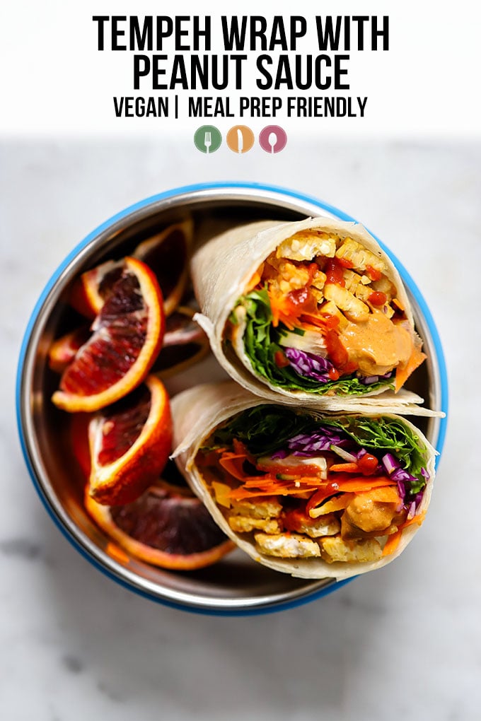 tempeh wrap with peanut sauce in bowl with orange