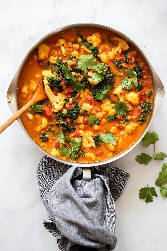 Healthy one-pot cauliflower curry in skillet with napkin.