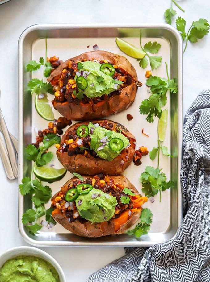 vegan loaded sweet potatoes in sheet pan.