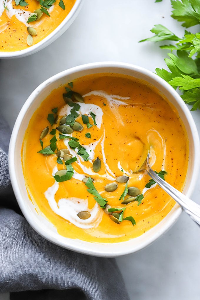 butternut squash soup with coconut milk swirled into the top.
