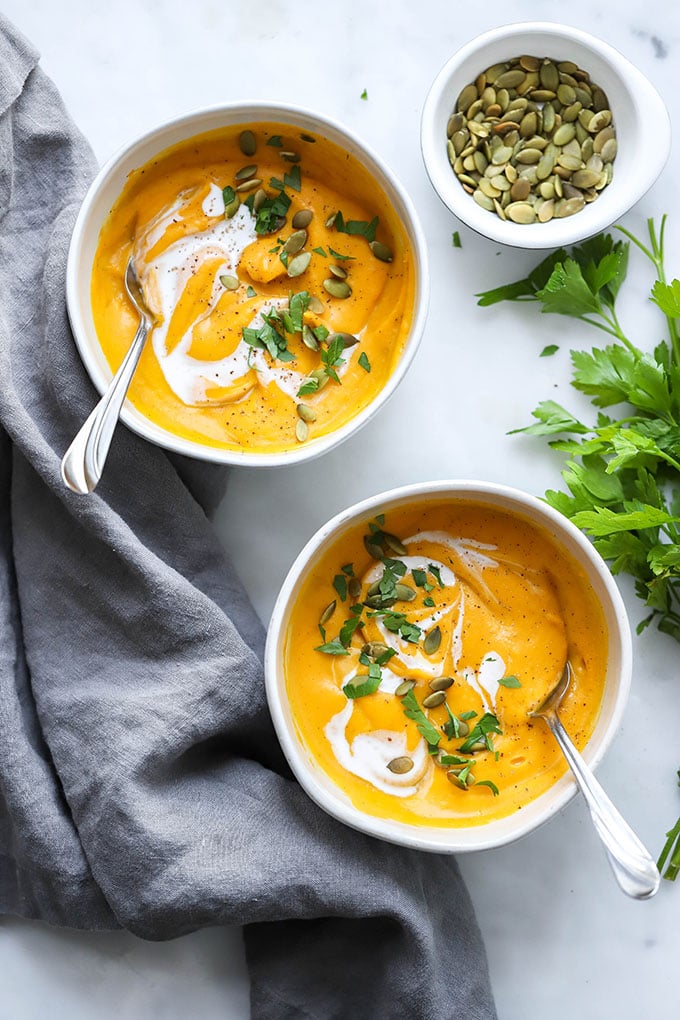 roasted butternut squash soup garnished with parsley.