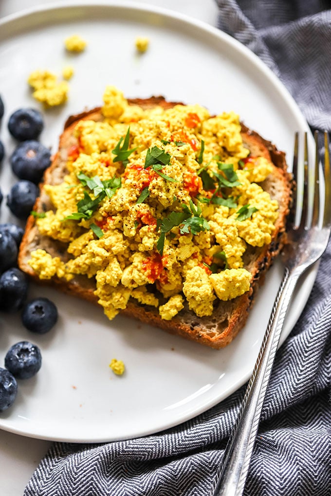 easy vegan tofu scramble on toast with fork