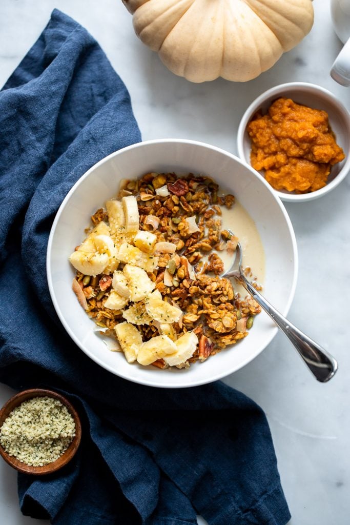 vegan pumpkin spice granola in white bowl