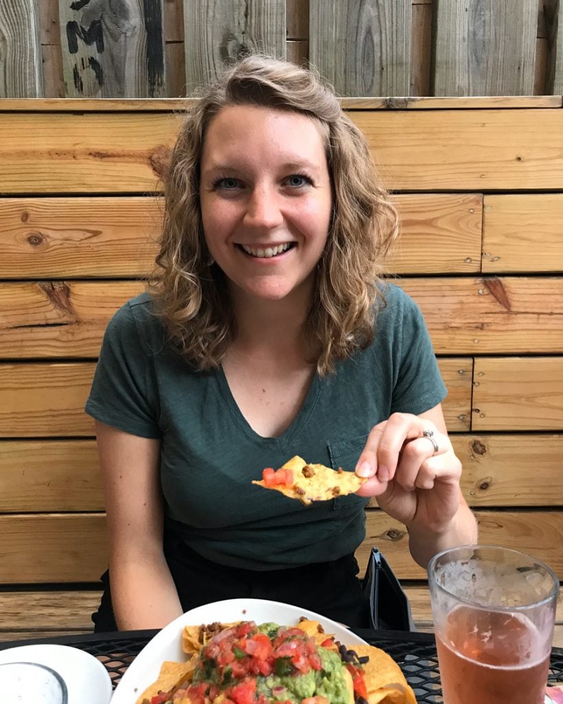 photo of deb with plate of nachos.