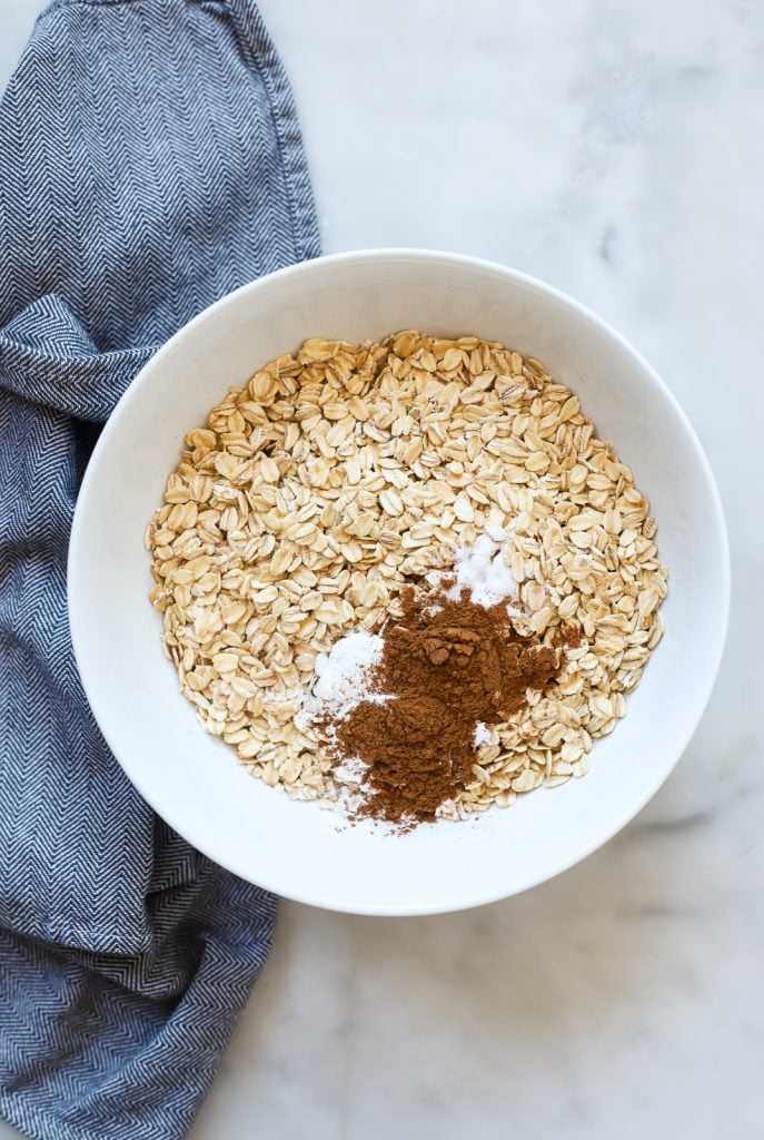 Add dry ingredients (oats, leavening, spices) to a bowl. 