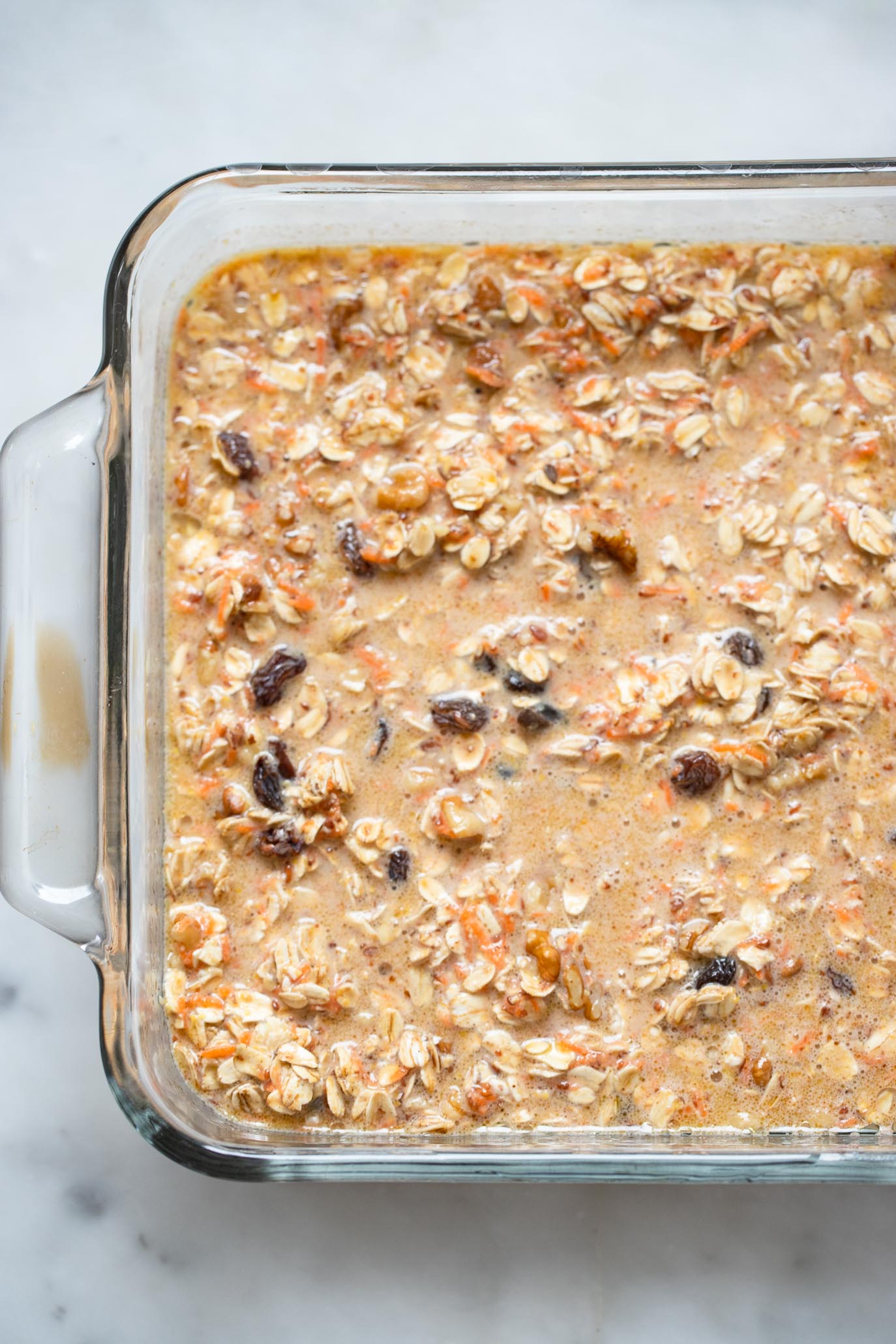 carrot cake baked oatmeal batter in baking dish