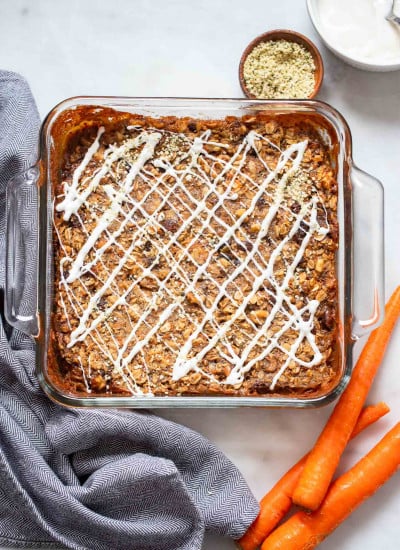carrot cake baked oatmeal with vanilla yogurt piped on top.
