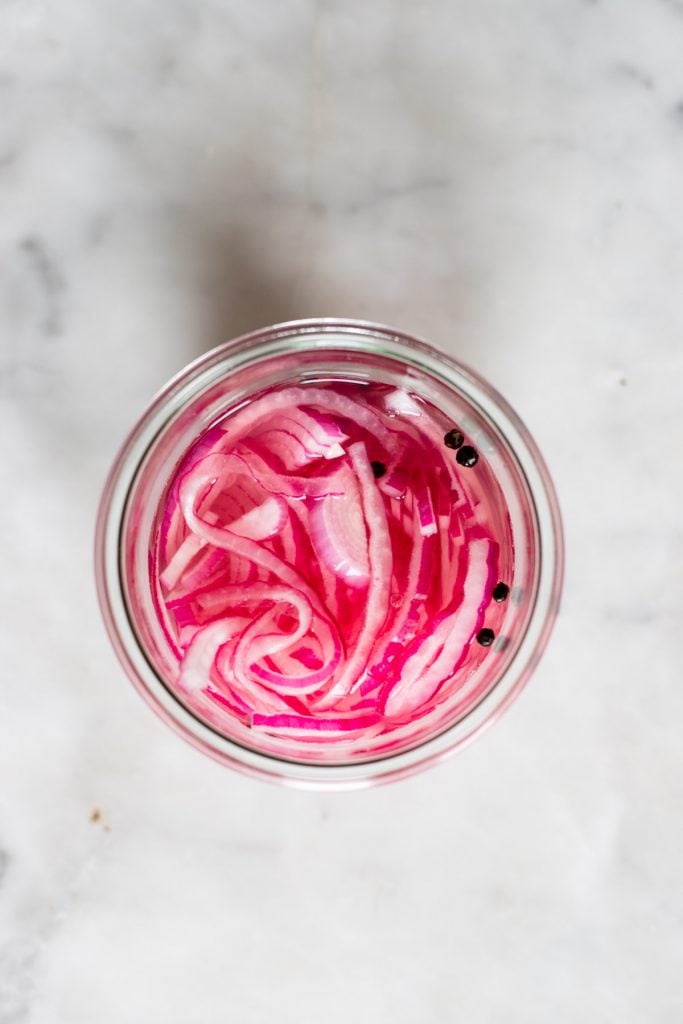 homemade pickled red onion in glass jar