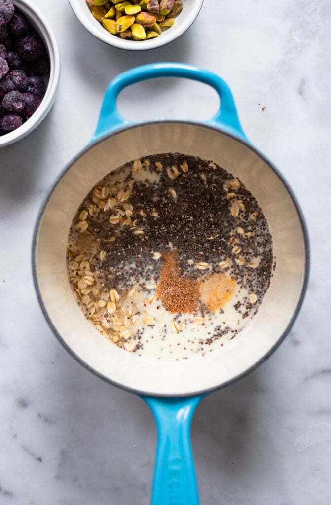 uncooked oatmeal ingredients in saucepan