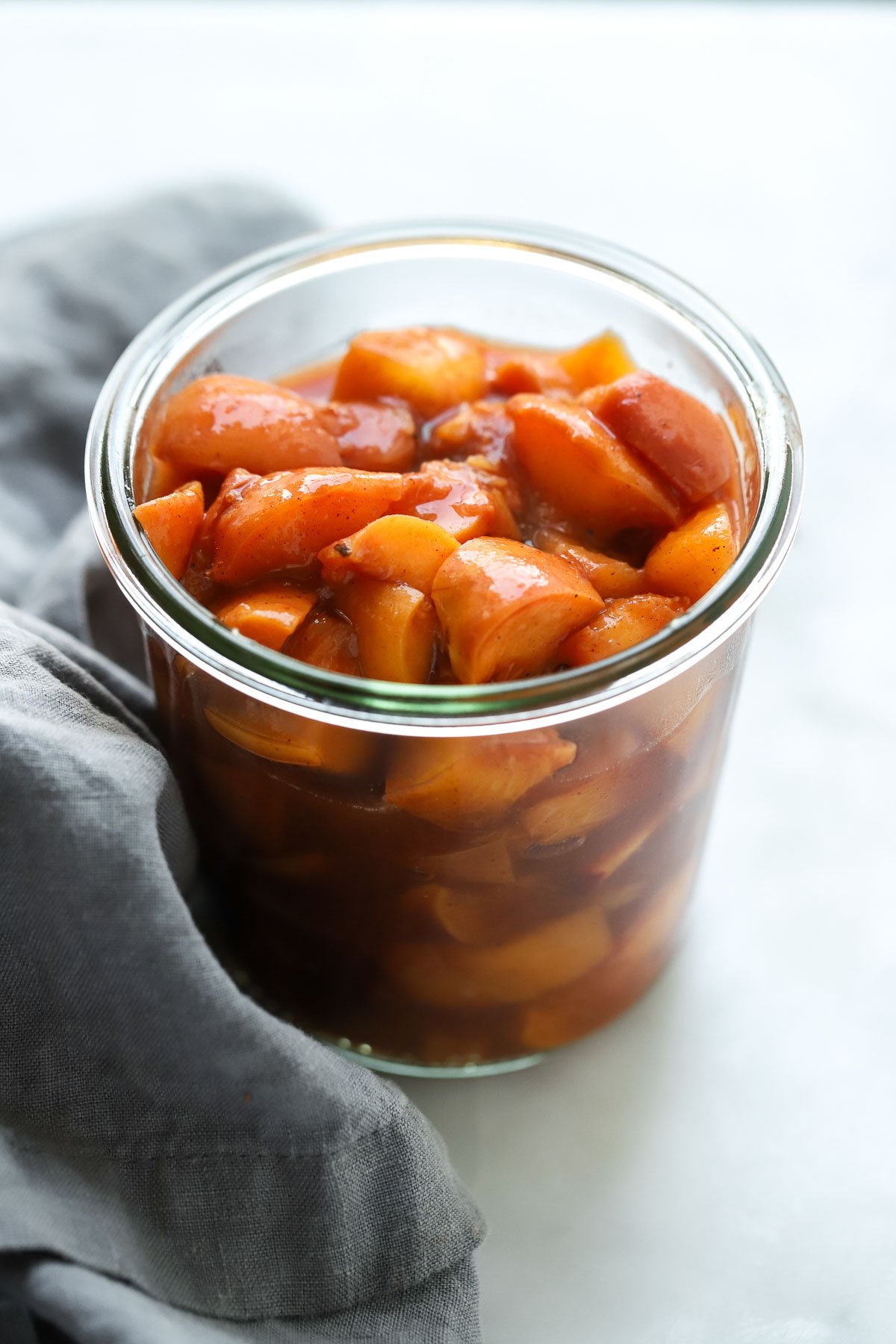 chilled peach compote in jar.