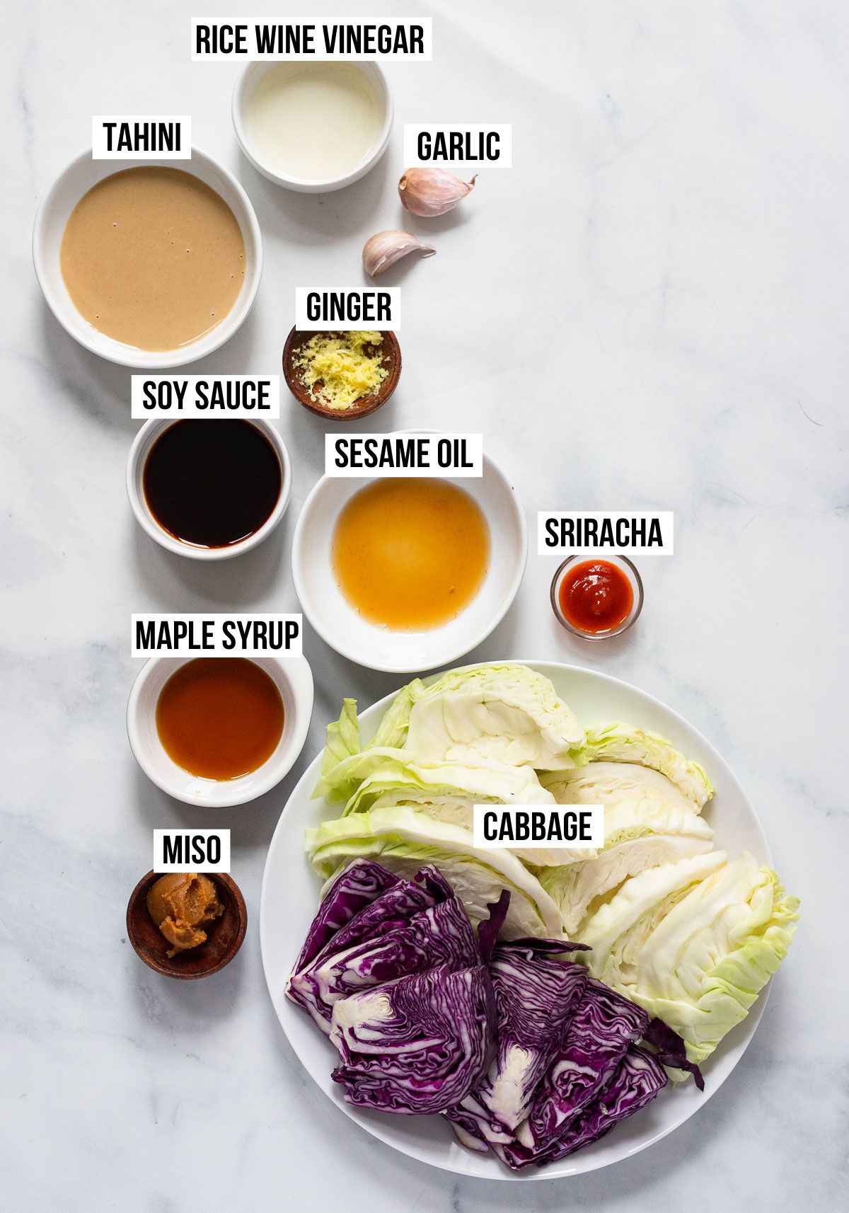 roasted cabbage and tahini sauce ingredients in small dishes