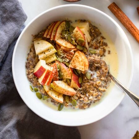 cinnamon oatmeal topped with chopped apples.