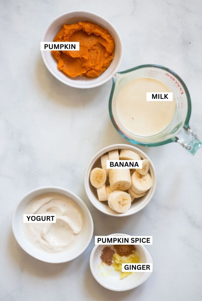 pumpkin spice smoothie ingredients in small dishes.