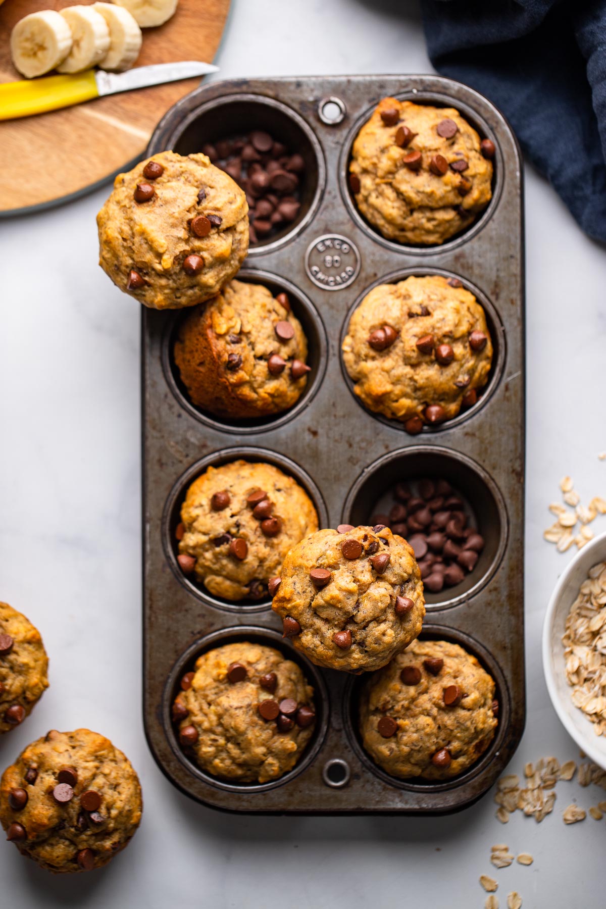 banana chocolate chip muffins in muffin tin.