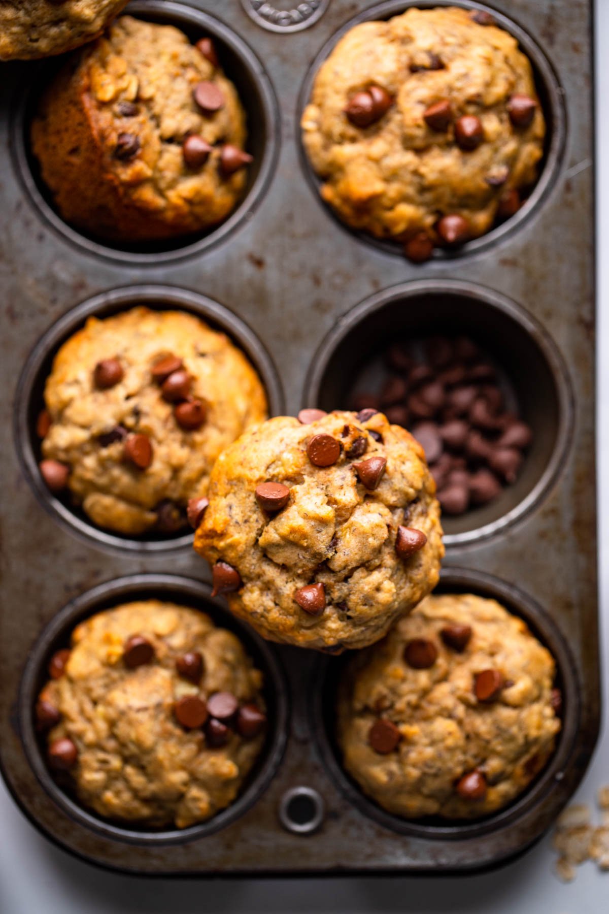 banana oatmeal muffins in vintage muffin tin.