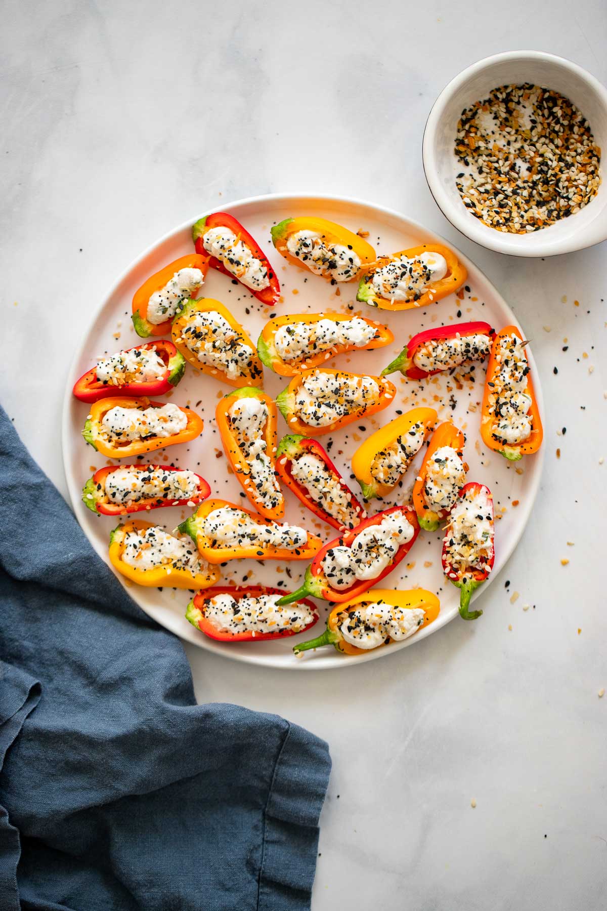 mini stuffed peppers arranged on plate. 