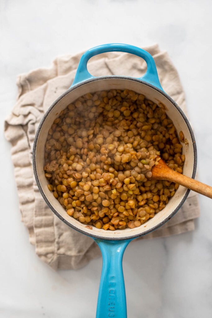 cooked lentils in saucepan.