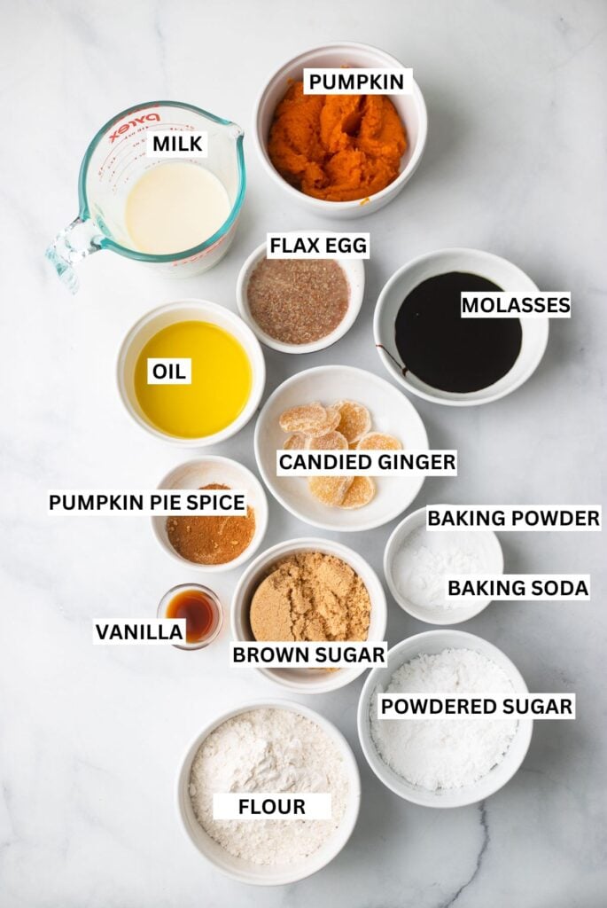 pumpkin gingerbread ingredients in bowls with labels.