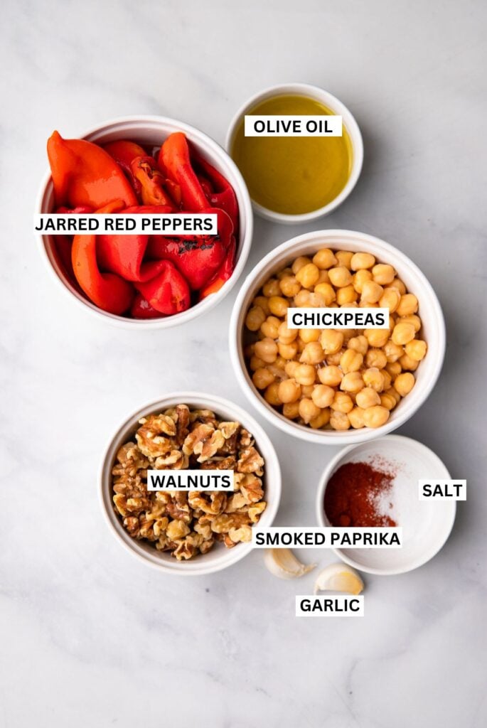 roasted red pepper dip ingredients in bowls with labels.