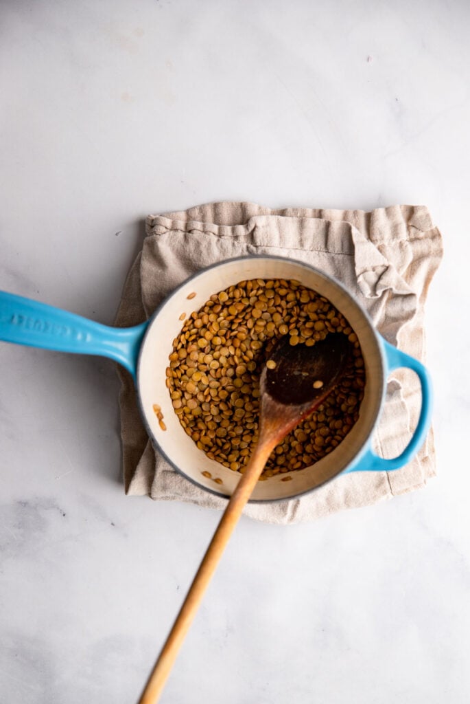 cooked lentils in a small saucepan.