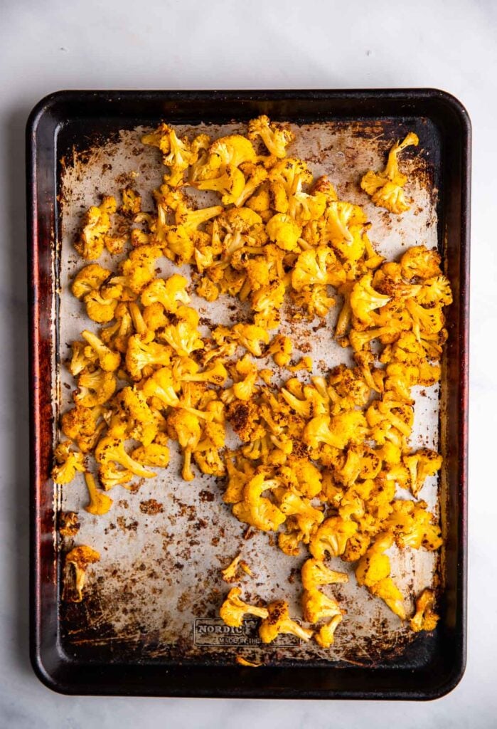 roasted spiced cauliflower in a sheet pan.