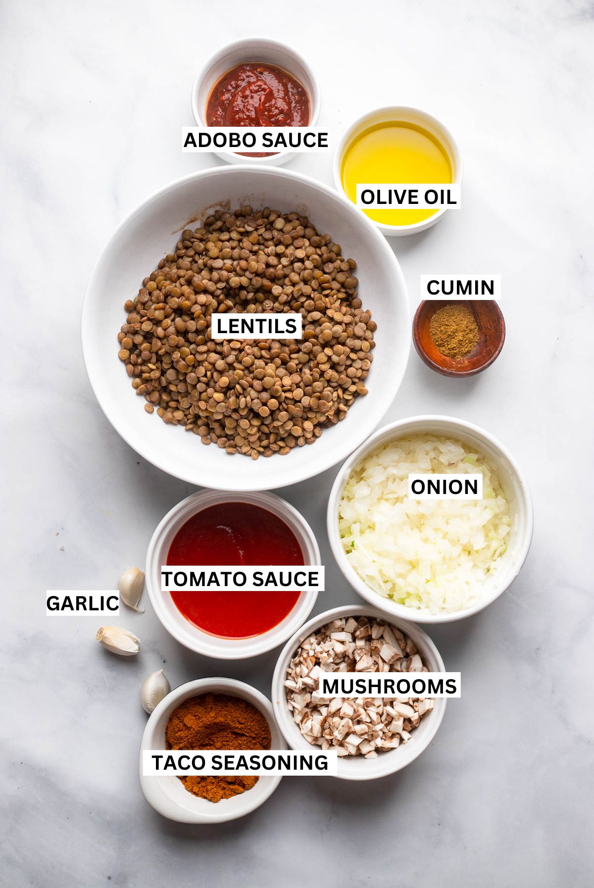 vegan lentil taco ingredients in small bowls with labels.