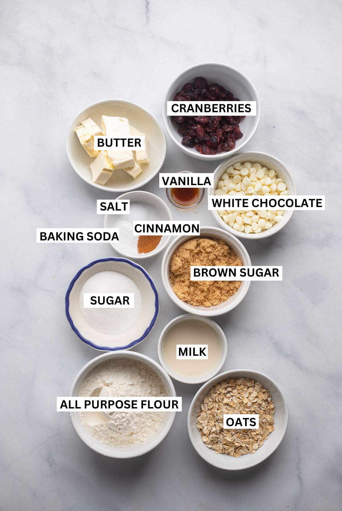 oatmeal cookie ingredients in small bowls with labels.