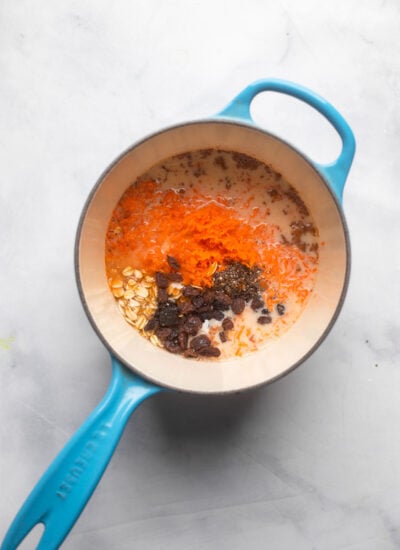 carrot cake oatmeal ingredients in small saucepan before cooking.