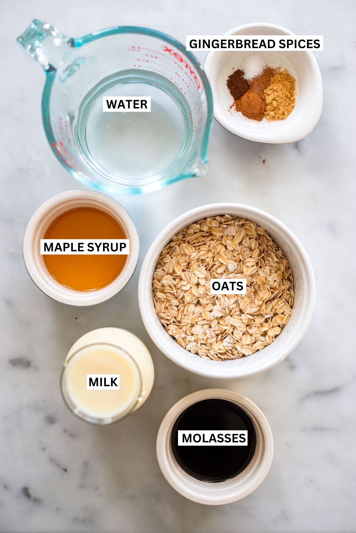 Gingerbread oatmeal ingredients in small bowls with labels.